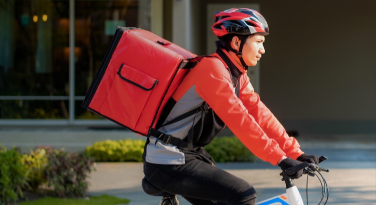 Delivery person on a bike